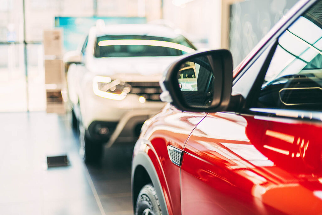 red-and-white-cars-parked-indide-at-dealer-shop-c-2022-02-25-22-57-24-utc-copy.jpg
